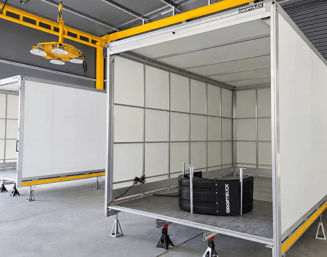 Panelled DROPTRUCK body with an open rear in the workshop
